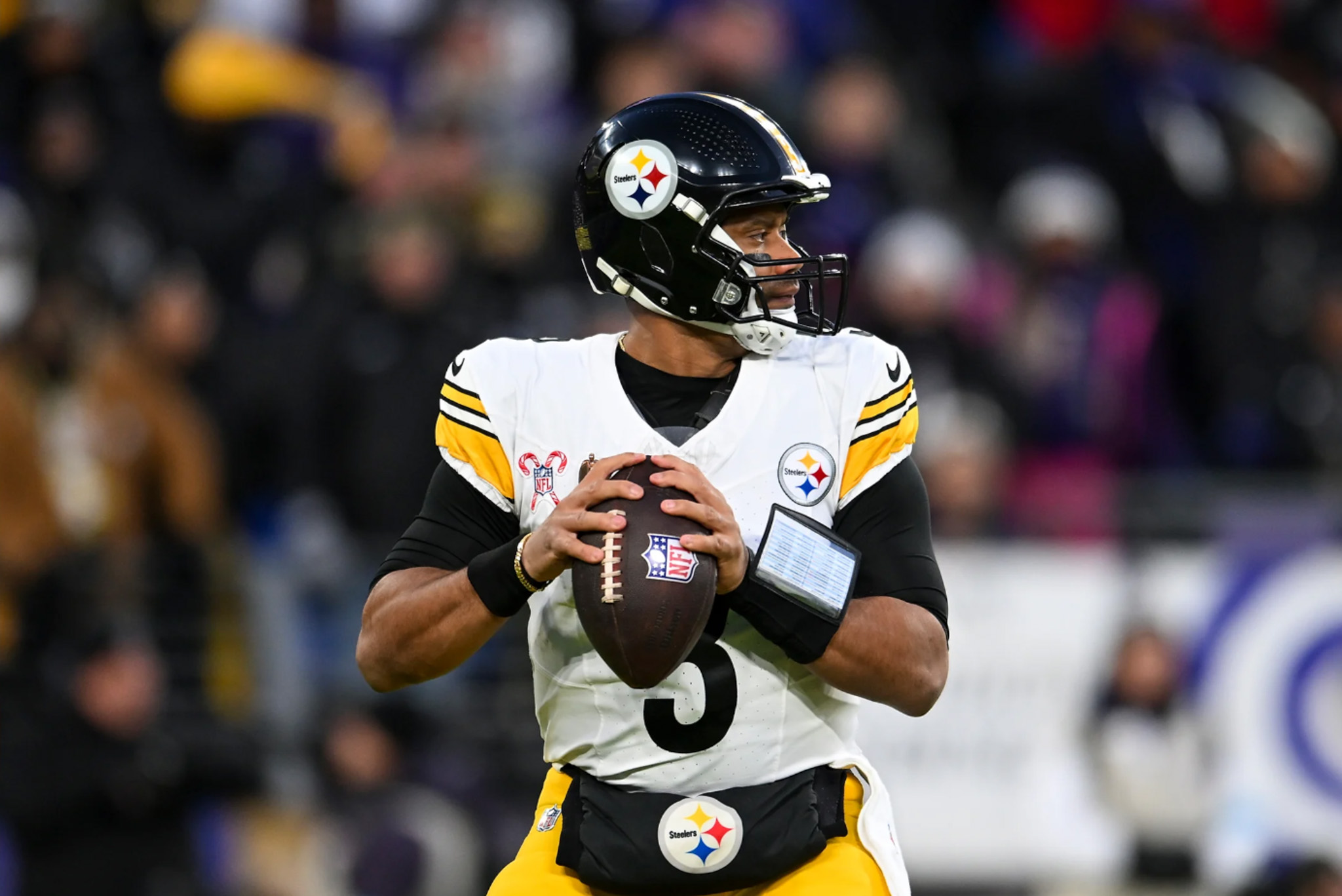 Steelers' quarterback Russell Wilson drops back in the pocket during Pittsburgh's loos to the Ravens on Saturday. | Photo by Alysa Rubin/Pittsburgh Steelers
