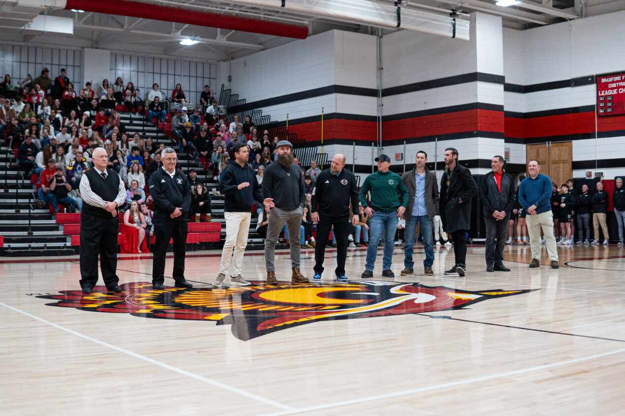 Ahead of the varsity game, Bradford honored the 'Dream Team,' one of two Owls squads that led an undefeated campaign. Standing at center court is head coach Dave Fuhrman, (left to right), assistant coach Mike Manning Sr., Jerry Burgos, Mike Manning Jr., Andy Terwilliger, Cory Hayden, Jason Wells, Cory Mead, Tim Simons and Kevin Minich. | Photo by Hunter O. Lyle