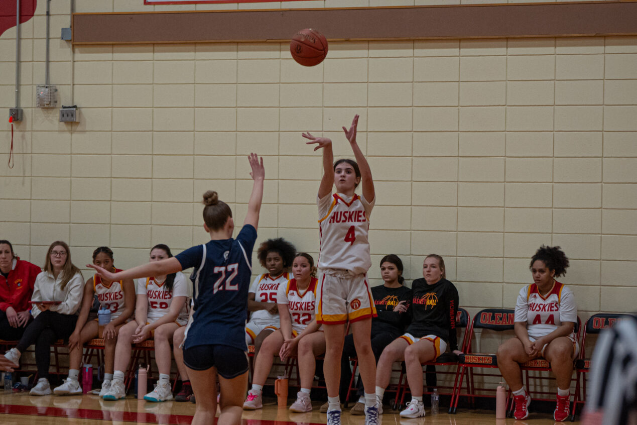 Alaina Hirliman takes a contested jump shot during Olean's loss to the Lady Trojans. | Photo by Hunter O. Lyle