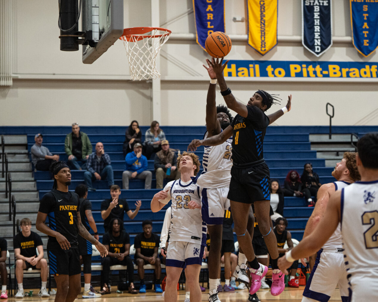 Pitt-Bradford's Jamarion Butler stretches out for a contested layup during the Panthers' win over Houghton on Tuesday, Dec. 10. | Photo by Taylor Komidar