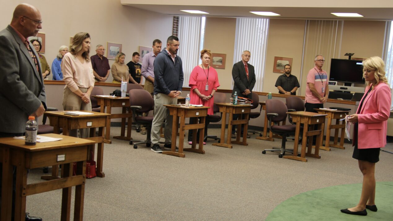 (Rick Miller/Olean Star) Cattaraugus County Legislature Leader Kelly Andreano of Olean gave her acceptance speech at Wednesday's reorganization meeting. She's shown here leading fellow legislators in an opening prayer.