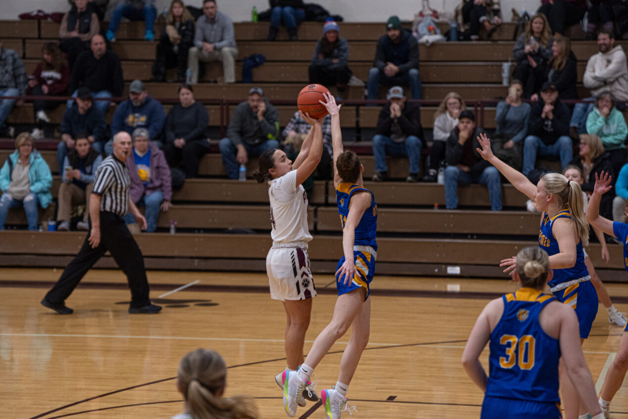 Addie Bell (right) blocks Emma Rhinehart's jump shot during the Lady Terrors' win over Portville. | Photo by Hunter O. Lyle