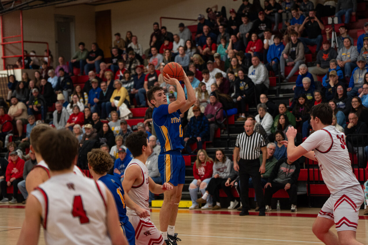 Manning Splain takes a jump shot from beyond the arc during O-E's sweep of Cameron County. Splain ended with seven points in the win. | Photo by Hunter O. Lyle
