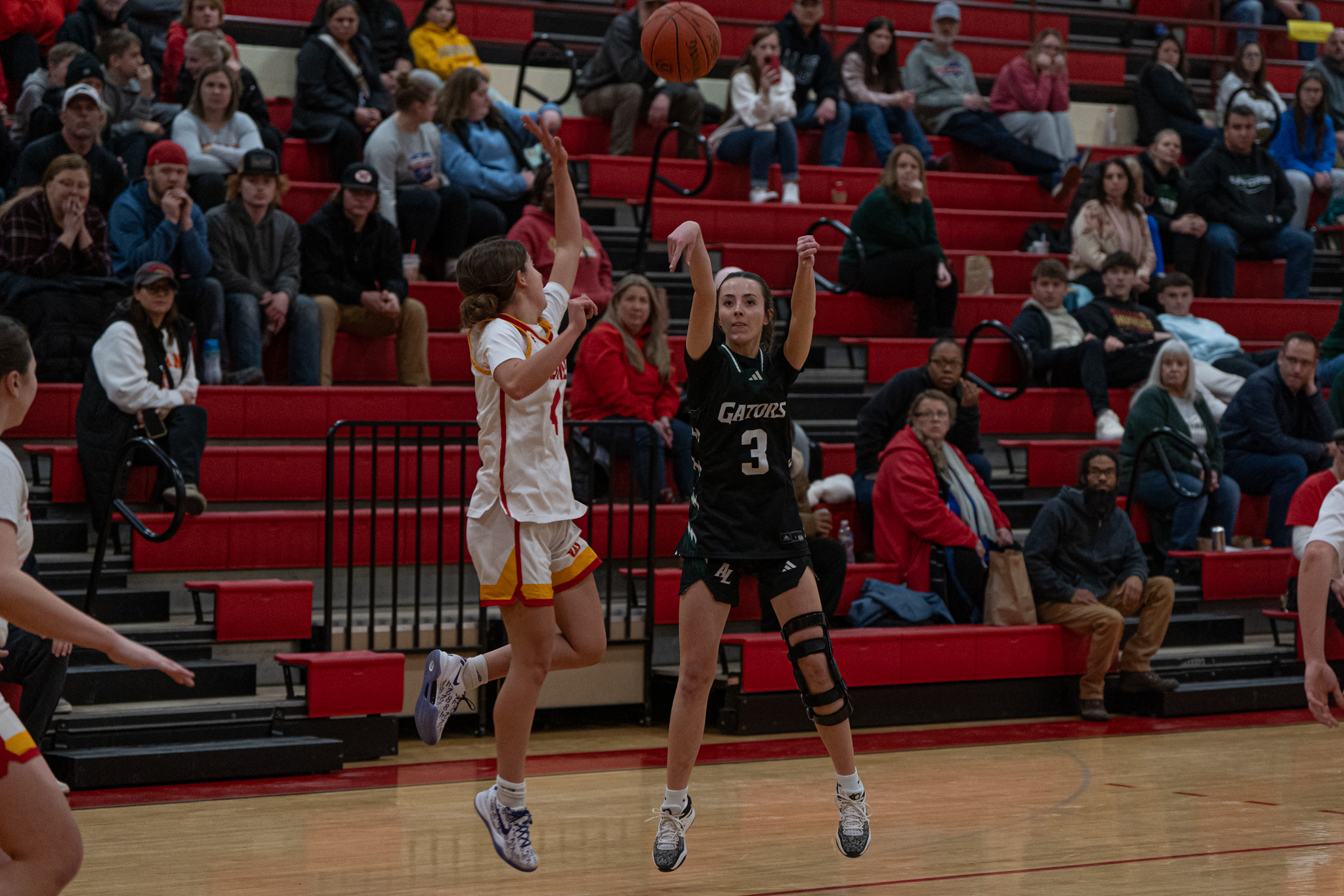 Allegany-Limestone's Maddie Kahm takes and makes a contested 3-pointer during the Lady Gators' 48-31 win over Olean. | Photo by Hunter O. Lyle