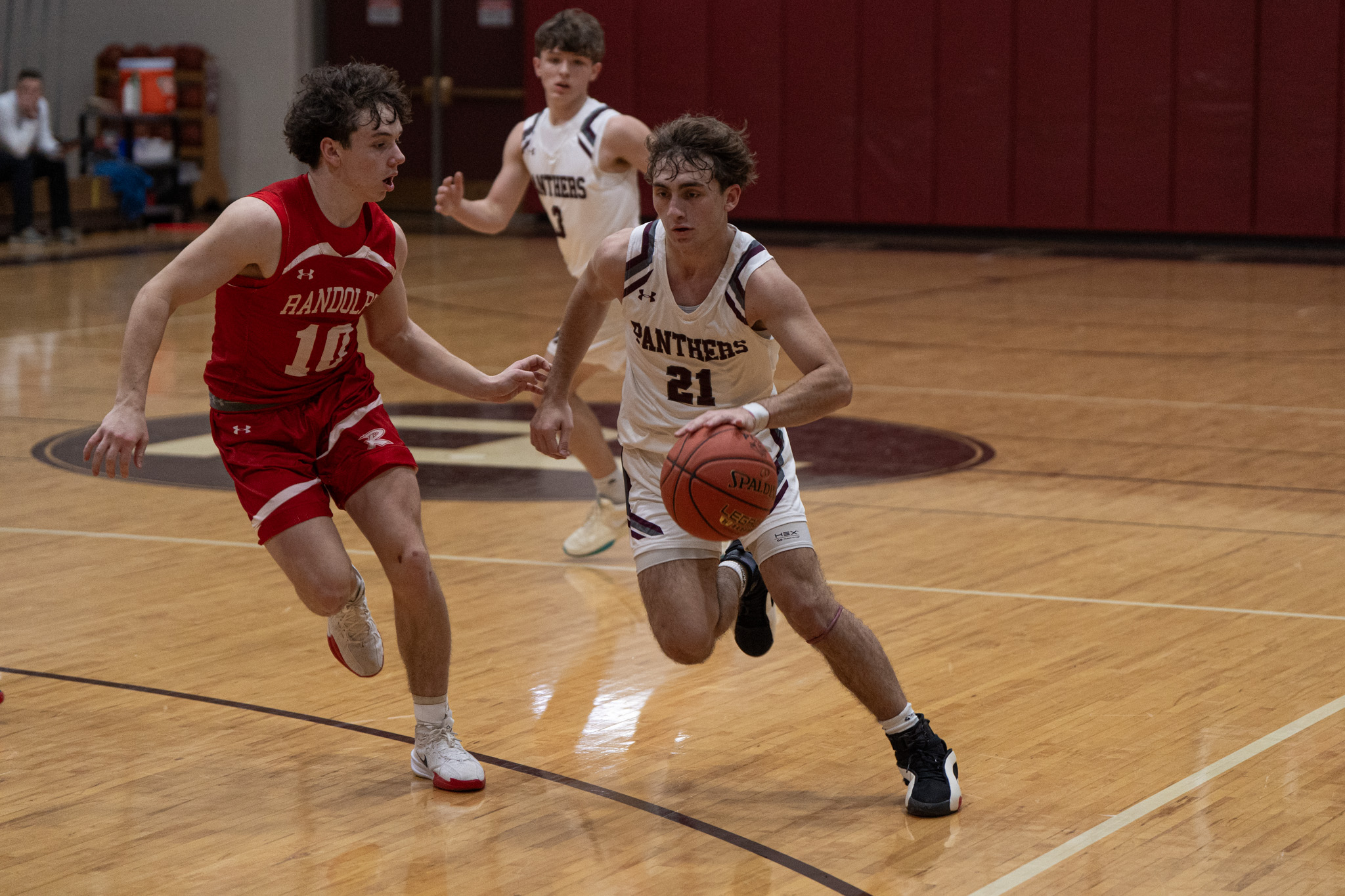 Portville's Aidan DeFazo drives through contact and into the paint during the Panthers' loss to Randolph. In his return to injury, DeFazo scored a team-high 25 points. | Photo by Hunter O. Lyle