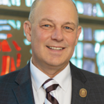 ST. BONAVENTURE — Dr. Jeff Gingerich has signed a contract extension that will keep him in place as St. Bonaventure University’s president through May 2030. The university’s Board of Trustees previously approved the extension. “I’m grateful to our trustees for their show of faith in my leadership. These first three years as president of this remarkable university have been the most fulfilling of my career in higher education,” Gingerich said. “But I want to be clear that their show of faith is just as much about the tremendous work of the administrators, faculty and staff I’ve been blessed to be surrounded with as it is about me.” Gingerich, who’s worked in higher education since 2000, began his presidency at SBU in the summer of 2022. Since then, the university has welcomed the three largest freshman classes in 20 years, with total enrollment in fall 2024 — undergraduate and graduate — reaching the fourth-highest mark in university history. “Our Board’s unanimous approval of Jeff's contract extension is a testament to Jeff's dedicated leadership. We’ve had extraordinary momentum under his tenure, including record student enrollment, new academic programs and greater engagement in the community,” said Michael Hickey, chair of the Board. “We’re very pleased with Jeff’s contributions to our Bolder Bonaventure fundraising campaign and commitment to increasing our endowment. His vision and orchestration of a long-term strategic plan will set the stage for growth and a vibrant future at St. Bonaventure.” Gingerich has traveled extensively across the country during his first three years, meeting with alumni and donors as the university nears the end of its seven-year Bolder Bonaventure campaign. The university is on the brink of reaching its $125 million fundraising goal well before the campaign ends May 31. Work on one of the pillars of the campaign — the major renovation of the Jandoli School of Communication — is scheduled to begin this spring. Gingerich has also worked to increase administrative transparency, communicating with the campus community through regularly scheduled Town Halls, President’s Hours and email updates on topics ranging from sustainability efforts and NCAA challenges to university finances and the complexity of building a budget. In his desire to enhance the university’s relationship with the neighboring Seneca Nation of Indians, the president worked to establish a committee made up of university and Seneca leaders to work on initiatives to rekindle their relationship, including the development of a Land Acknowledgement Statement. The land upon which SBU sits was once Seneca land. Gingerich also established a Sustainability Task Force and charged the University Planning Commission with developing a new strategic plan. Gingerich and his wife, Betsy, have hosted numerous social events across campus and at their home for students and staff to strengthen their bonds with the campus community. The president also established a now beloved campus tradition: the annual Christmas tree lighting at Marchiori Pavilion.