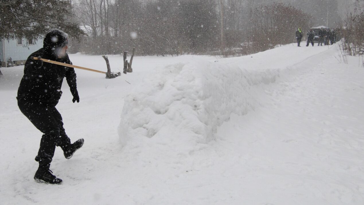 (Rick Miller/Olean Star)
A participant in Saturday's Fourth Annual Morrie Abrams Memorial Snowsnake Tournament releases his mudcat into a track of snow.