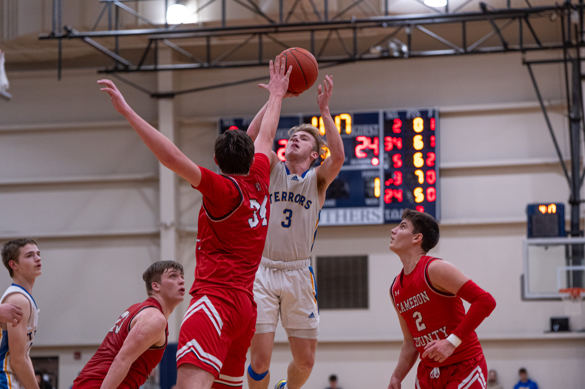Otto-Eldred's Landon Francis takes a contested jump shot during the Terrors' win over Cameron County in the District 9 Class A semifinals. Scoring 19 points on Tuesday night, Francis became the Terrors' all-time leading scoring with 1,708 career points. | Photo by Hunter O. Lyle