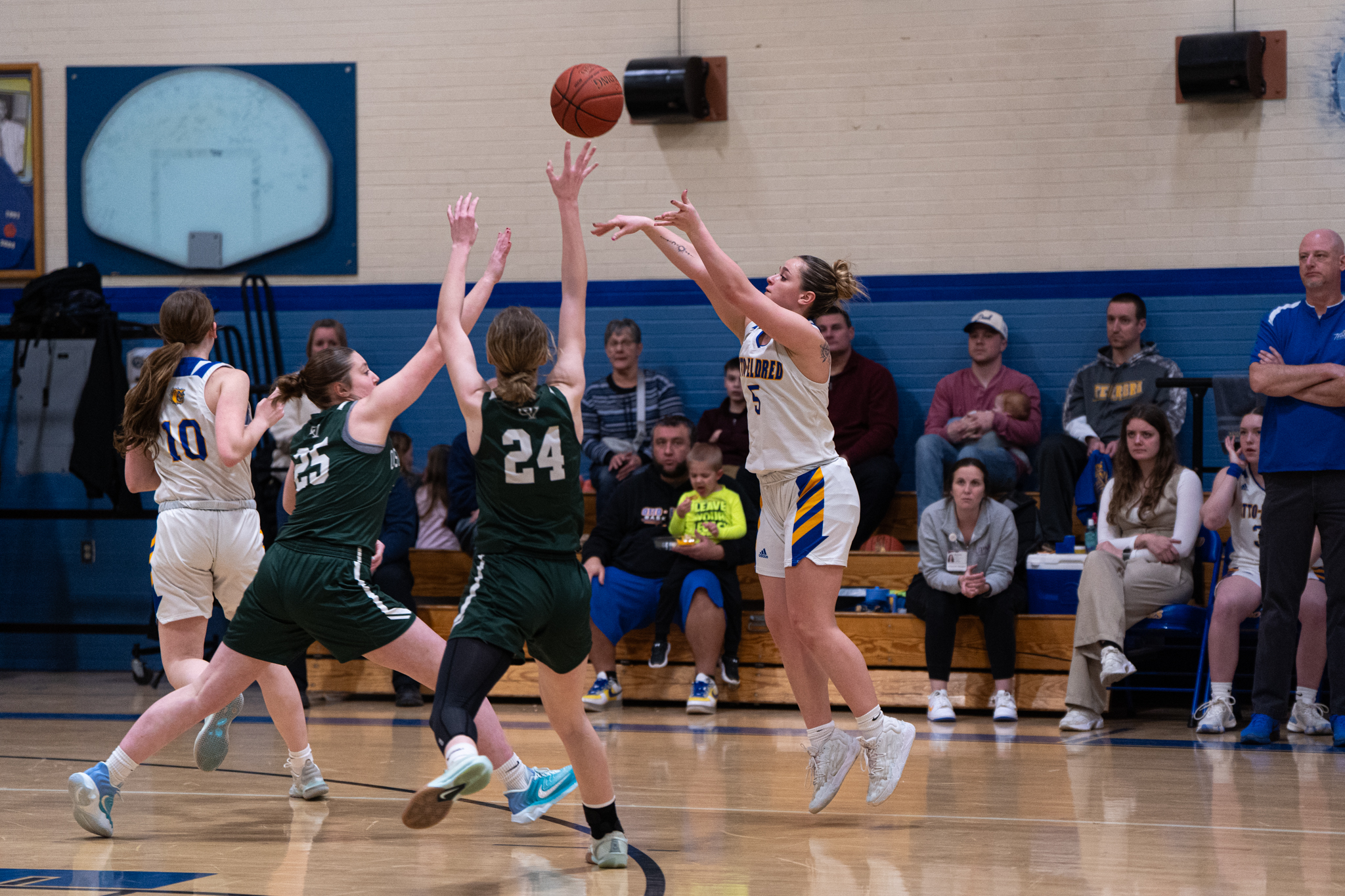 Otto-Eldred's Carrie Drummond takes a 3-pointer over two Oswayo Valley defenders. During the Lady Terrors' overtime win, Drummond would knock down four triples on her way to 18 points. | Photo by Taylor Komidar