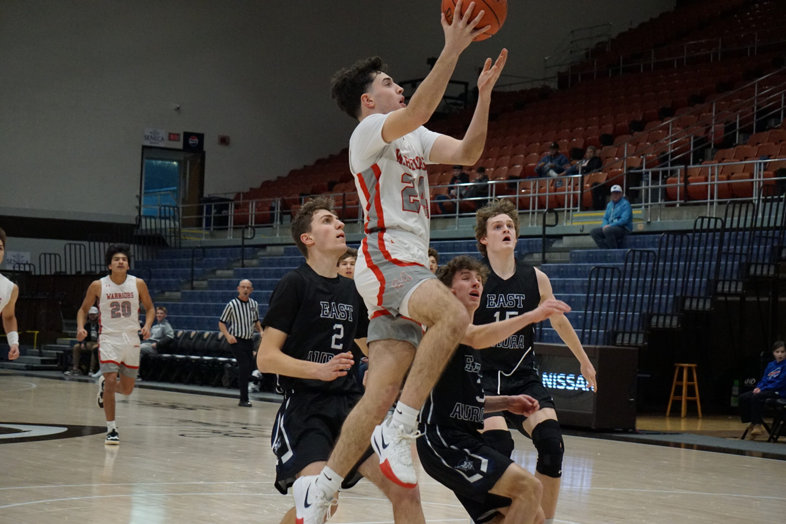 Corey Holleran soars to the hoop during the Warriors' win over East Aurora on Saturday. | File photo by Spencer Bates
