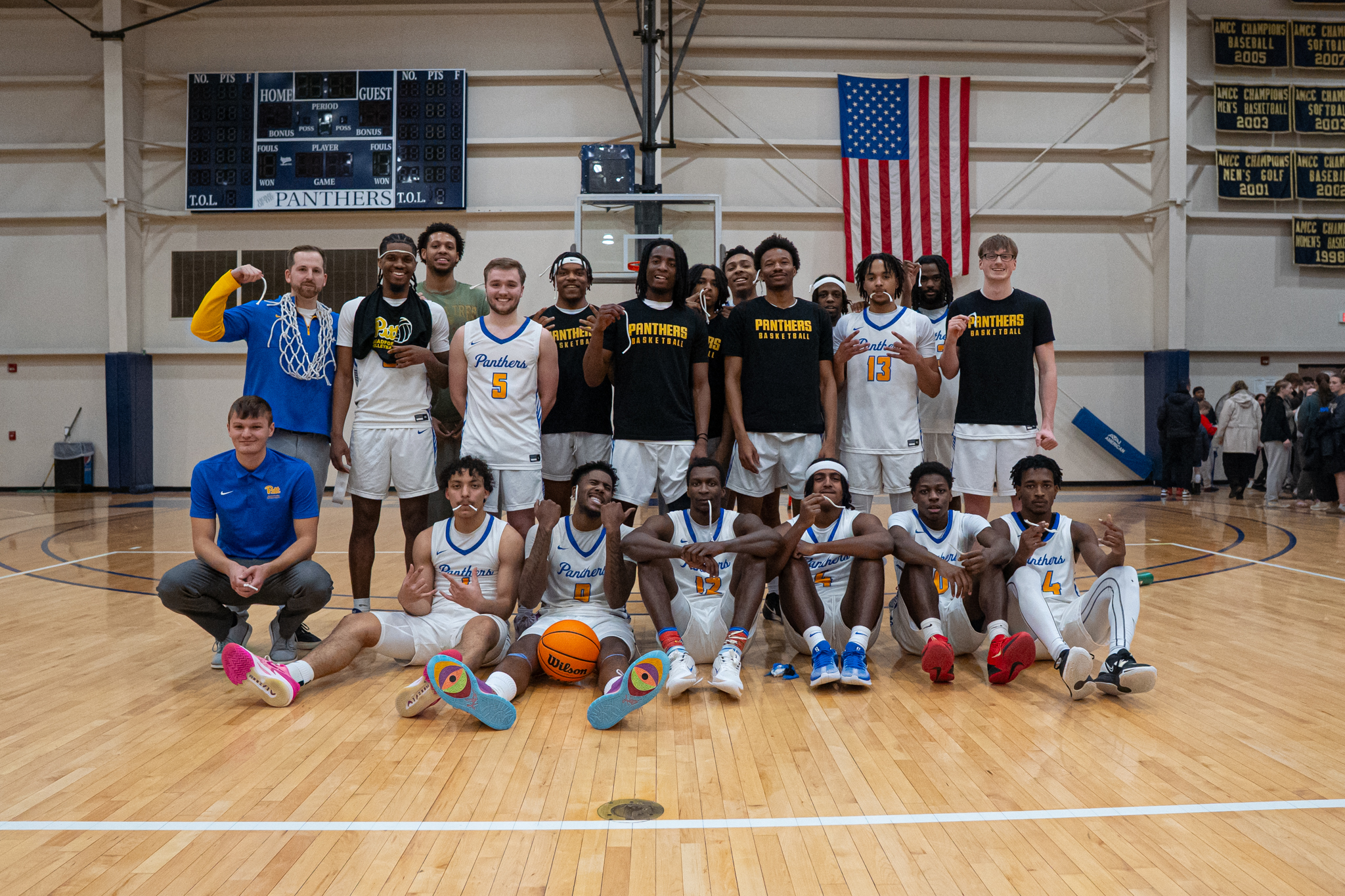 With a win over Penn St.-Altoona, the Pitt-Bradford mens' basketball team secured their first regular season championship in over two decades. After the win, the team cut their net in celebration. | Photo by Hunter O. Lyle