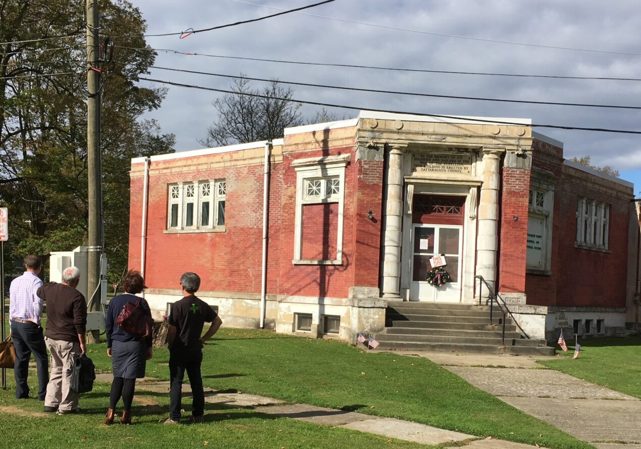 (Rick Miller photo) C.A.M.P. (Committee Advocating Memorial Preservation) officials stand outside the Cattaraugus County Memorial and Historic Building in Little Valley in October 2017 after they purchased it from the county. The building may soon be listed on the state and federal Registers of Historic Places.