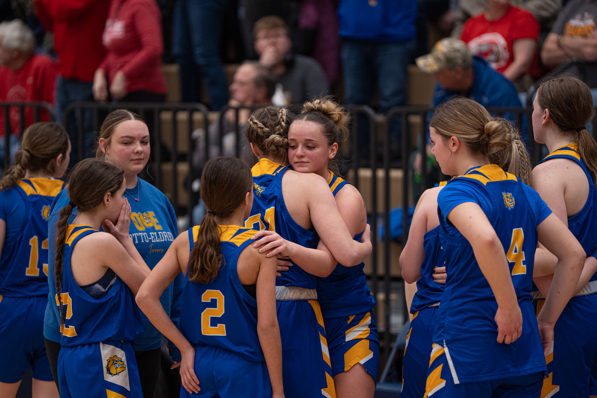 Otto-Eldred's Carrie Drummond comforts her teammates after the Lady Terrors' loss in the District 9 Class A championship. | Photo by Hunter O. Lyle