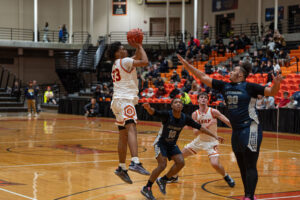 Olean's Mykel Rivera takes a contested jumper during the Huskies' loss to Lackawanna in the Section VI Class A2 semifinals. Rivera would end with a team-high 17 points. | Photo by Hunter O. Lyle