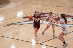 Portville's Emma Rhinehart passes out of a Wilson double team during their loss in the Class B2 semifinals. | Photo by Hunter O. Lyle