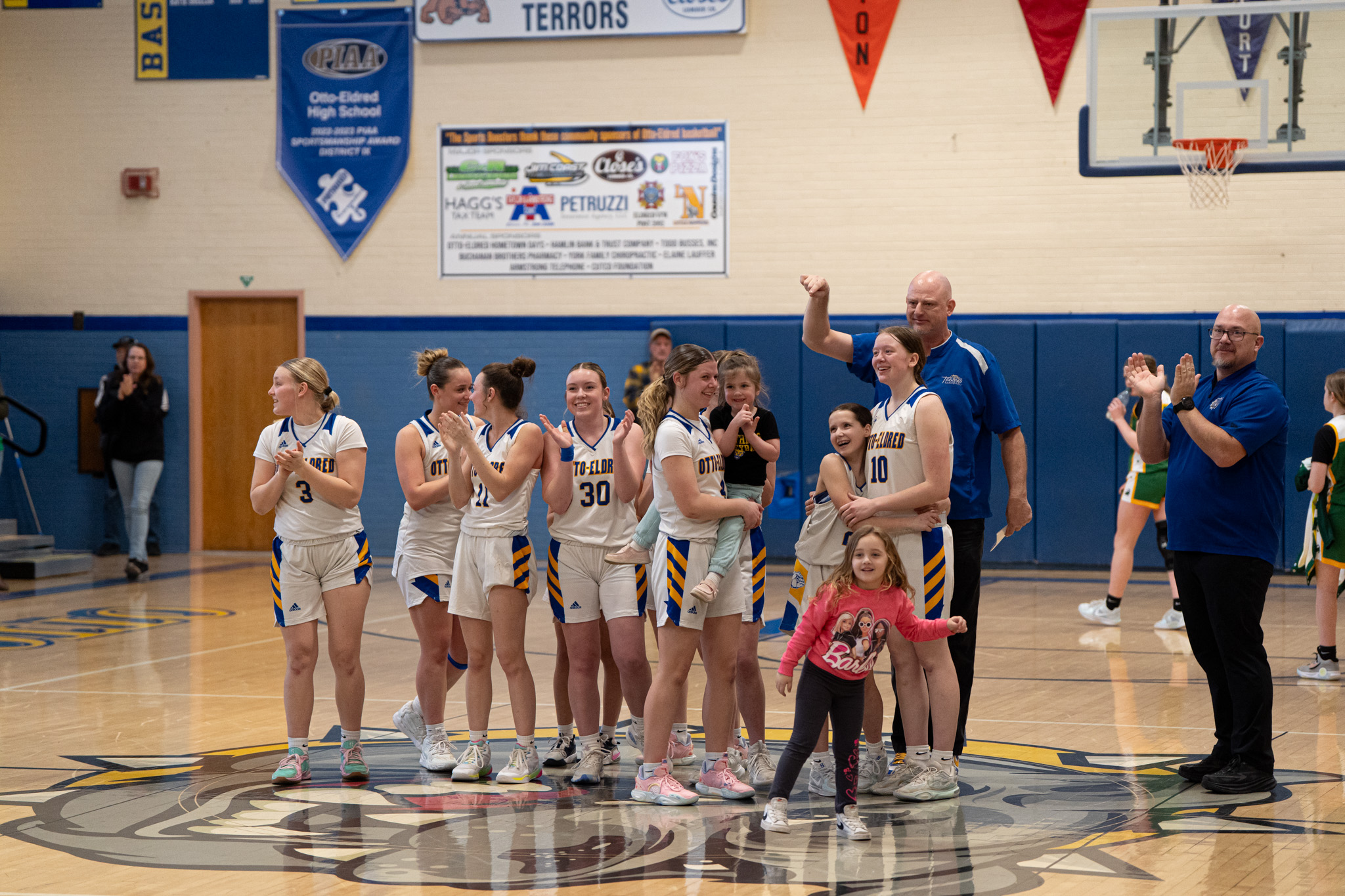 The Otto-Eldred girls' basketball team celebrates their win over Geibel Catholic in the first round of the PIAA state tournament. | Photo by Hunter O. Lyle