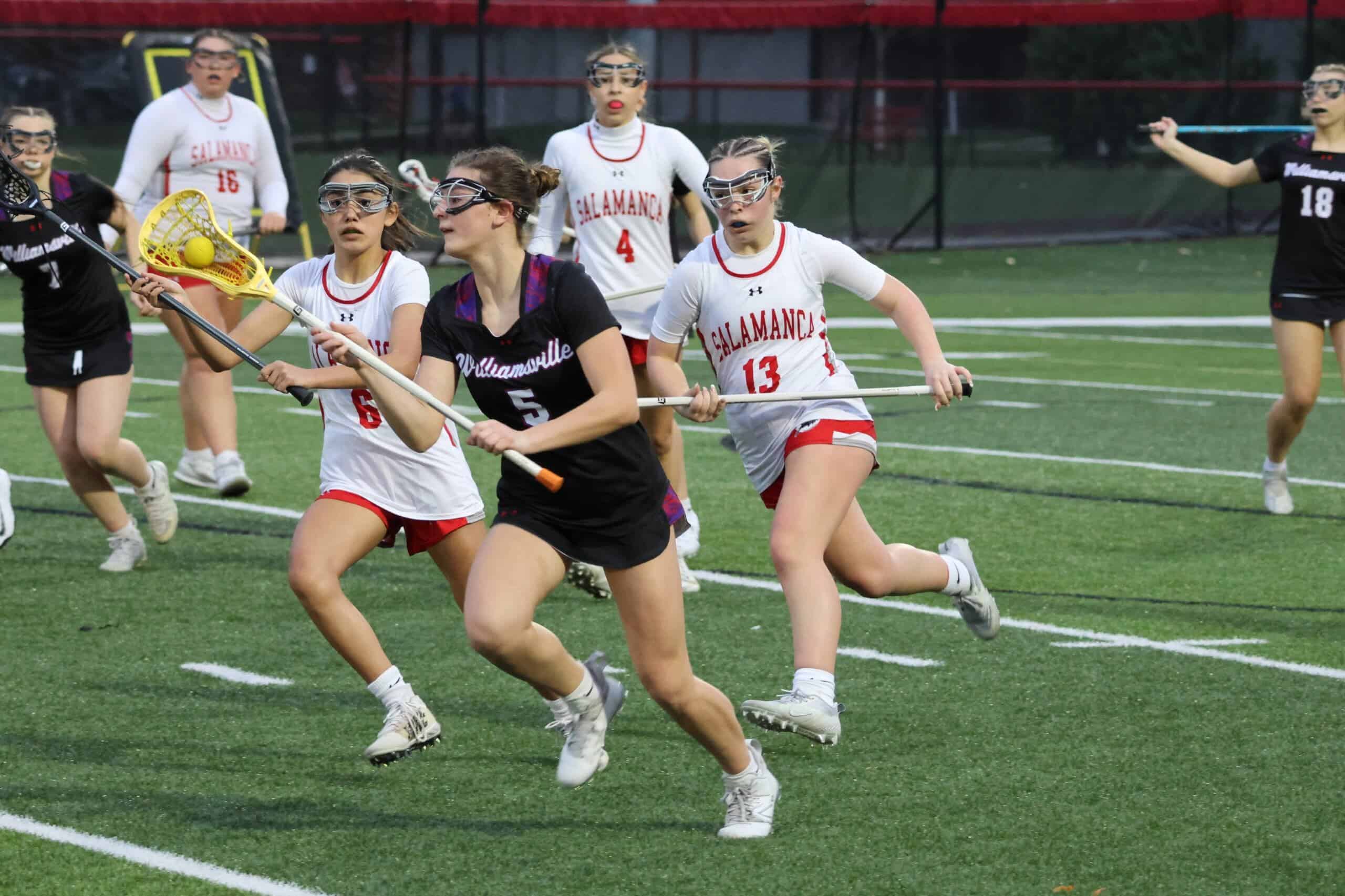 Salamanca's Lily Vogle (6) and Sophia Hodara (13) chase down a Williamsville South attacker. (Salamanca Warrior Athletics)