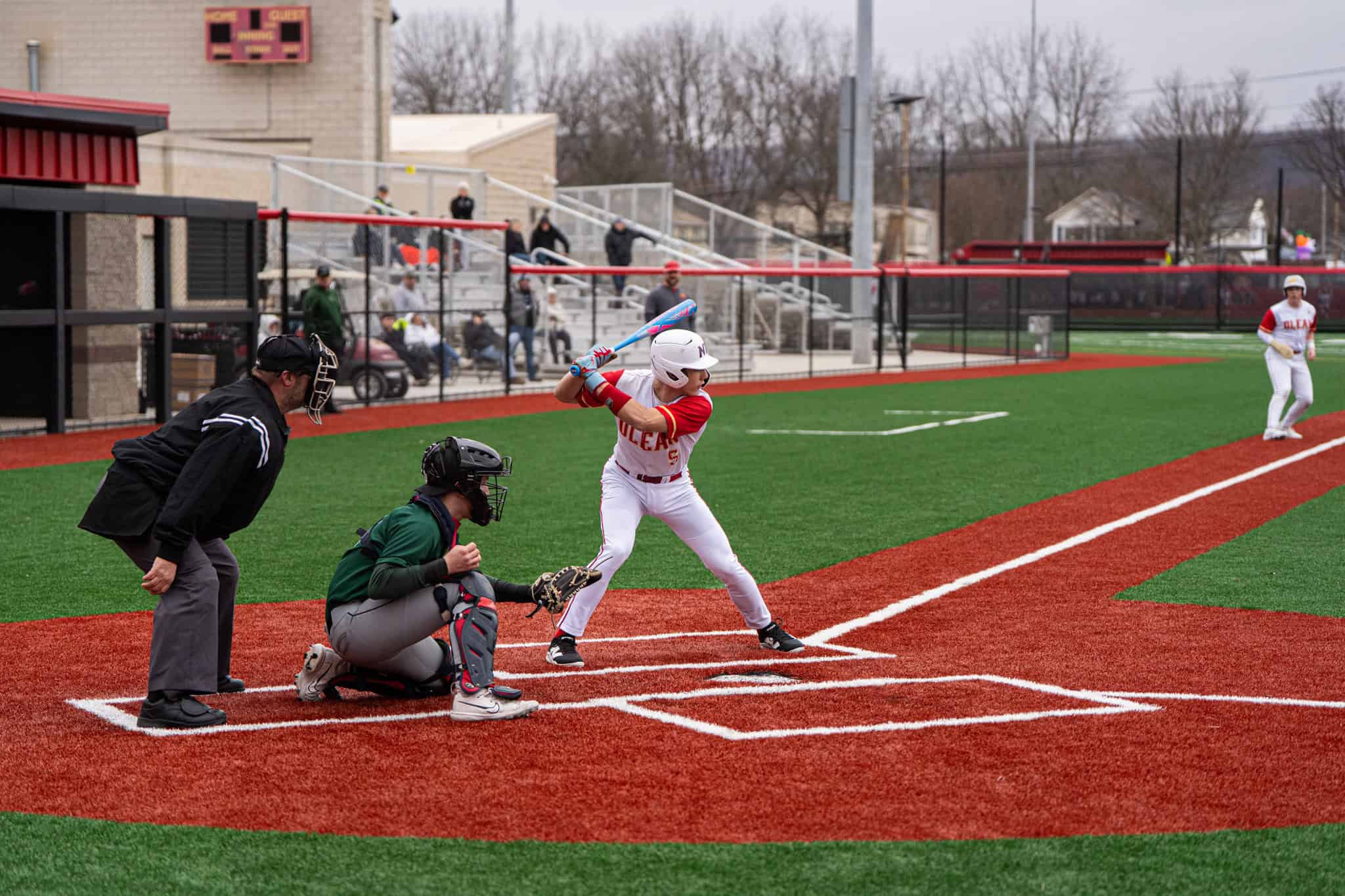 FILE: Olean's Caine DeGolier steps into the batters' box during the Huskies scrimmage against Pioneer on Monday. Against Frewsburg, DeGolier went 1-for-2 with one run scored. | File photo by Hunter O. Lyle